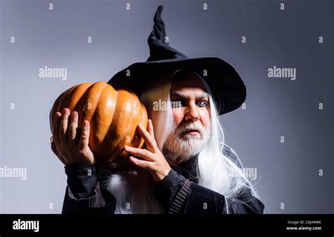 Man In Witch Hat With Pumpkin Scary Halloween Devil With Jack O