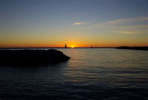 Sunrise Between The Lighthouses At Port Washington Wisconsin Image