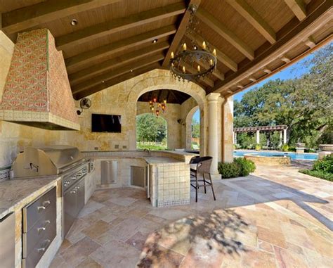 The storage area is mainly designed for your grill and additional this outdoor kitchen idea enables you to have a fully functional kitchen that can be used three seasons out of the year in cold climates, and. Outdoor Kitchen Designs Featuring Pizza Ovens, Fireplaces ...