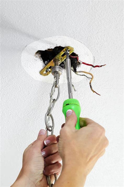 Recessed lighting, new construction, mounting frame that is perfect for install from below fixtures (i.e. How to Install a Light Fixture for a Fast Room Refresh ...