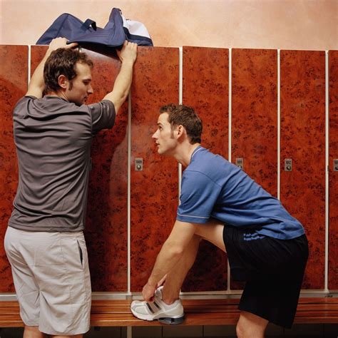 Two Men In Locker Room One Adjusting Laces Other Reaching For Bag Gmag