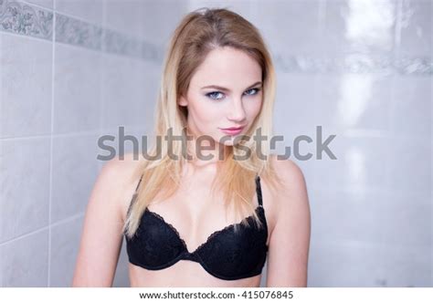 Sexy Blonde Woman In Bra At Bathroom