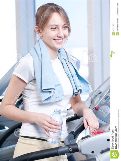 Woman At The Gym Drinking Water Stock Photos Image 20731163