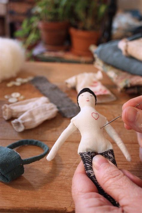 Moving Stuffing Inside A Rag Doll With A Needle Doll Making Cloth Cloth Dolls Handmade Doll