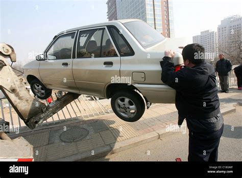 Driver escapes death in overpass car crash A car hangs precariously