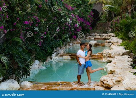 Couple Smiling Happy Couple On Vacation Multiethnic Couple At The Swimming Pool Swimming Pool