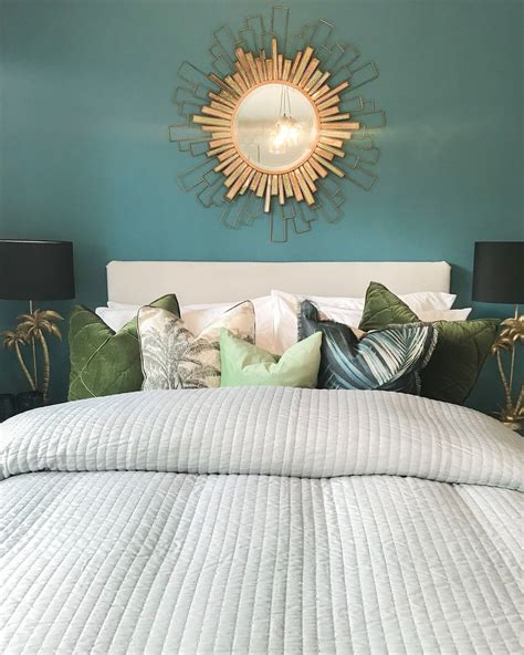 Teal And Gold Botanical New Build Bedroom With Sunburst Mirror And Palm