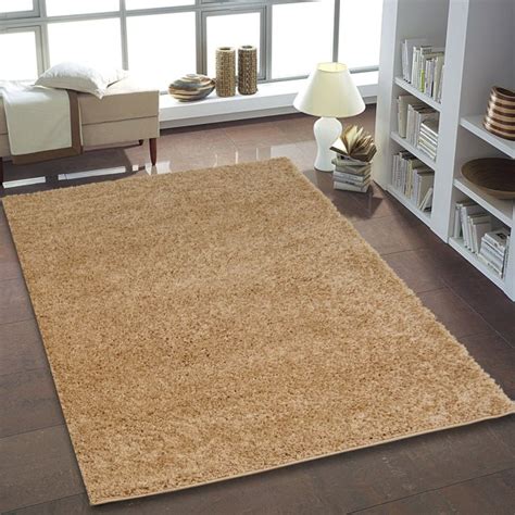 The tight patterns and vibrant untraditional colors in this polypropylene rug are sure to catch the eye of visitors. Ladole Rugs Shaggy Collection Soft indoor Solid Area Rug ...