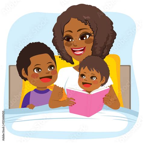 Young African American Mother Reading Bed Time Tale Story To Son And