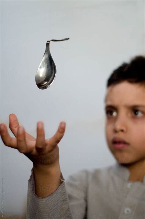A Boy Bending A Suspended Spoon Via Telekinesis Del Colaborador De