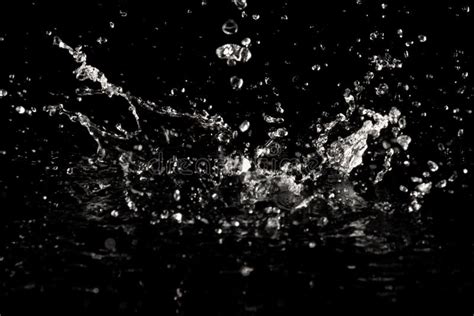 Splashes Of Water Drops On A Black Background Macro Stock Photo