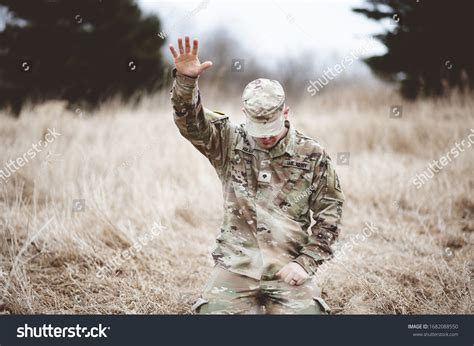 Soldier Kneeling In Prayer
