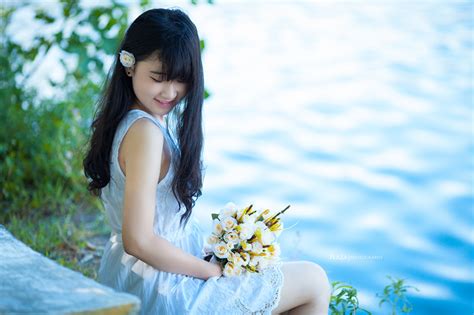 Pictures Brunette Girl Smile Bouquet Young Woman Asian Hands Sitting