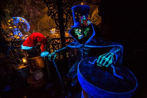First Look Hatbox Ghost Joins The Celebration In Haunted Mansion
