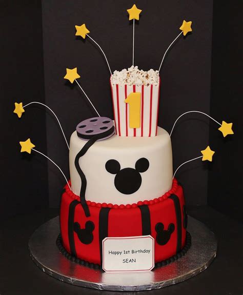 A Mickey Mouse Birthday Cake With Popcorn And Stars
