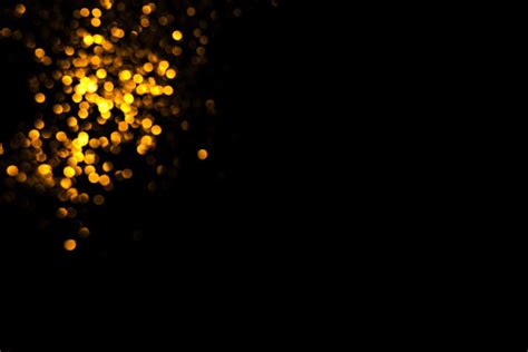 Golden Abstract Bokeh On Black Background Stock Photo Download Image