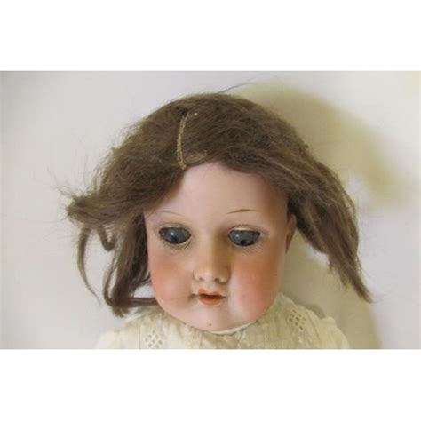 An Armand Marseille Bisque Shoulder Head Doll With Blue Glass Sleeping