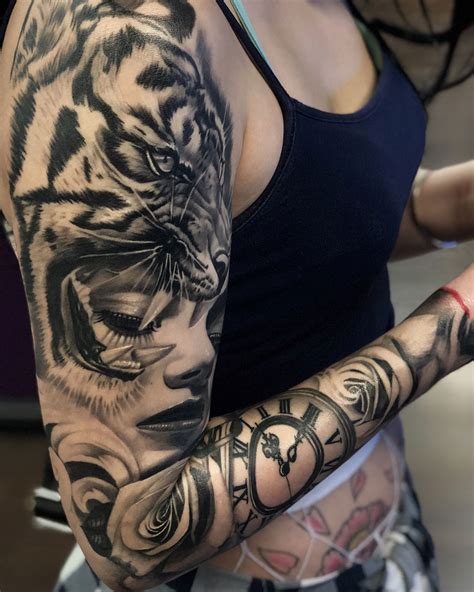The incredibly beautiful tiger head tattoo embellishes the girl's back. Tiger & Portrait Sleeve