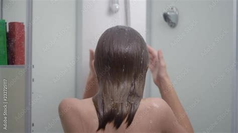 Young Girl Bathing Under A Shower At Home Back View Beautiful Teen Girl Taking Shower And