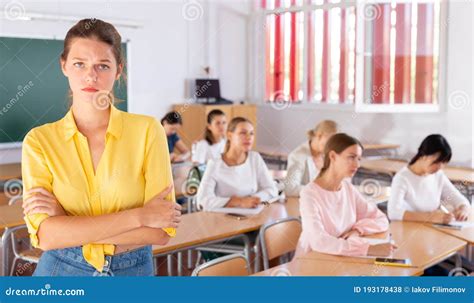 Upset Female Student Standing In Classroom Stock Photo Image Of