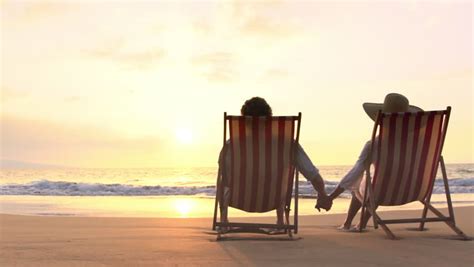 Retirement Vacation Concept Happy Mature Retired Couple Enjoying Beautiful Sunset At The Beach