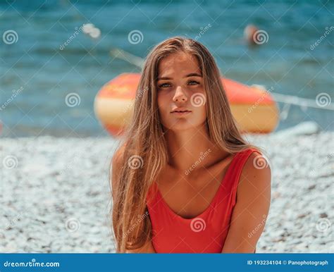 Young Beautiful Sensual Woman In A A Red Bikini On The Beach Beauty