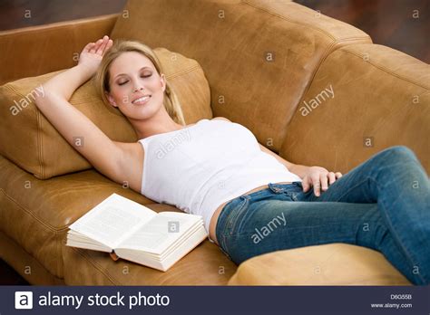 How to choose your sofa bed. Young woman sleeping sofa Stock Photo: 55674343 - Alamy