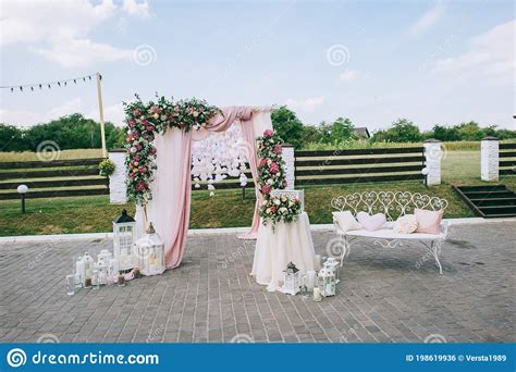 Wedding Arch Made Of Fabric And Fresh Flowers Roses Hydrangeas
