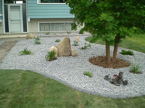 Rock gardens can bring a natural, rugged beauty to any yard, including those with steep hillsides or other difficult growing conditions. Boulders, Feature Rocks & Bubblers | Whitemud Landscaping and Garden Center Edmonton