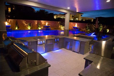 Grill, island, storage, even refrigeration & a sink! Outdoor Living Architecture | Green O' Aces Pools & Landscape