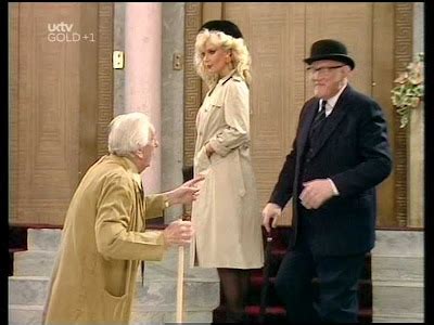 Trenchcoated Candy Davis In Are You Being Served Circa