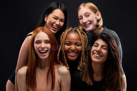 Young Attractive Women Mixed Race Group Of Models Posing Laughing