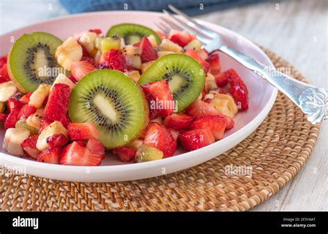 Healthy Fruit Salad With Strawberries Bananas And Kiwis On A Plate