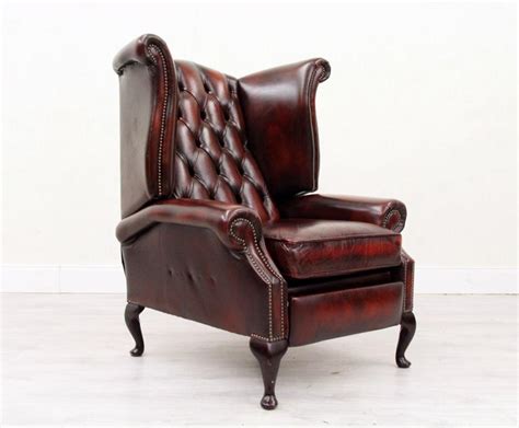 Green chesterfield wingback chair with mildly worn arms. Chesterfield Armchair Leather Antique Wing Chair Recliner ...