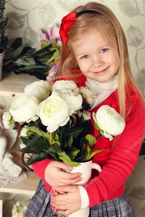 Cute Little Child Girl With Spring Flowers Happy Baby