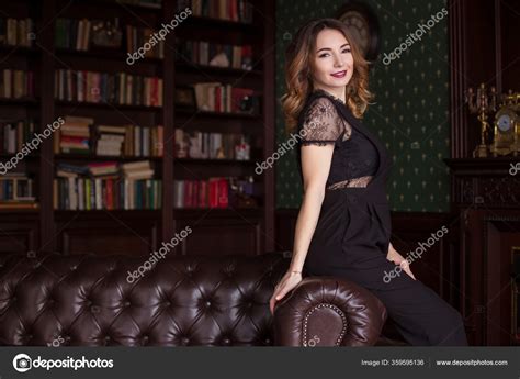 Beautiful Stylish Woman Sitting Chesterfield Sofa Her Hands Clasped Her