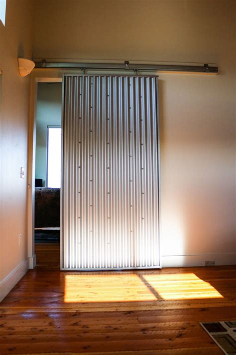 Check out this interior sliding door made from corrugated metal in