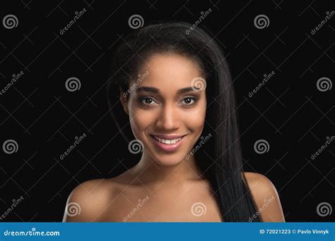 Portrait Of Smiling Handsome Nude Mulatto Woman On Dark Background