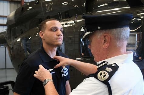 First Caymanian police helicopter pilot gets his wings - Cayman Compass