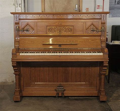 An 1895 English Gothic Style Ibach Upright Piano With A Carved Oak