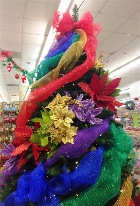 She said she just followed the directions in the youtube video below and added two colors of deco mesh! Ideas and Inspirations: Rainbow Deco Mesh Christmas Tree