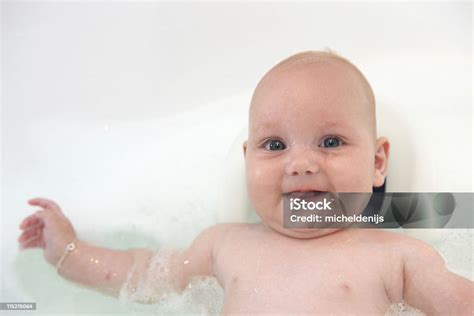Baby Girl Splashing In Bath Stock Photo Download Image Now Bathtub