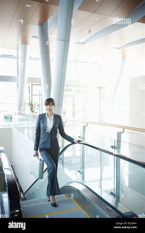 A Business Woman Going Up The Stairs Stock Photo Alamy