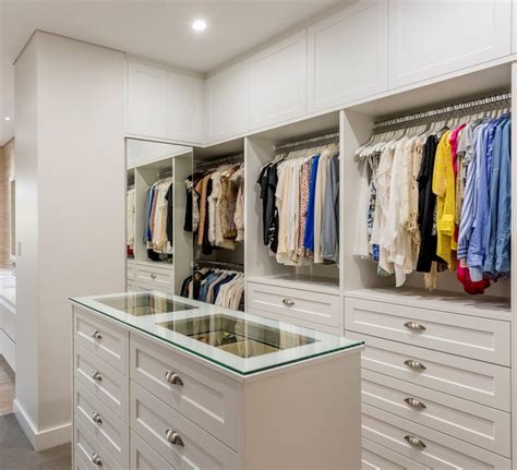 Walk in wardrobe - drawer island with glass top | Wardrobe room