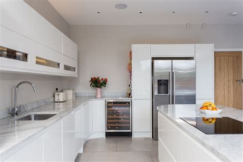 From sleek, handleless slab cabinets to traditional shaker designs, show more there's a style to bring your vision to life in our stunning collection of showroom. Handleless Gloss White Malmo Kitchen with Island and ...