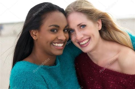 Portrait Of Two Multicultural Girls Smiling Royalty Free Stock Photos