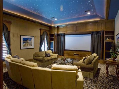 This living room boasts a theater area, an elegant black billiard pool with a beige cloth and a bar area lighted by classy ceiling lights. Media Room Design Ideas | HGTV