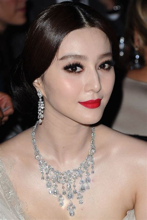 Fan definition, any device for producing a current of air by the movement of a broad surface or a number of such surfaces. Fan Bingbing Net Worth - Celebrity Sizes