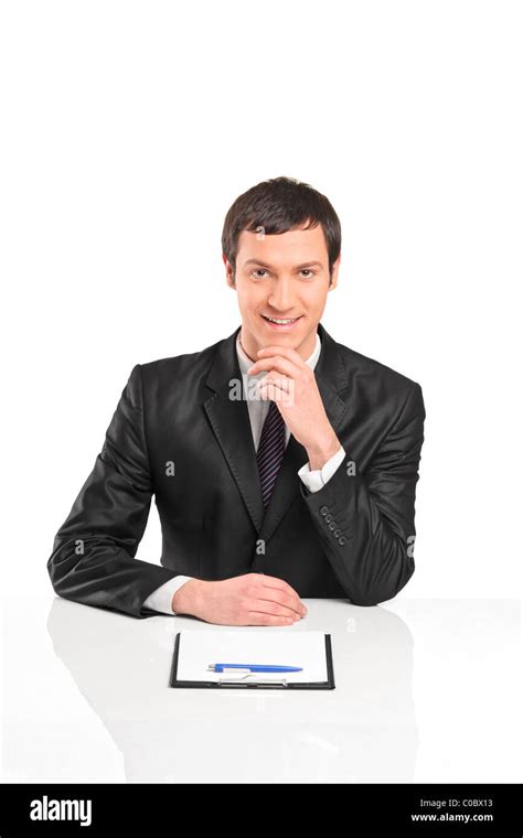 A Portrait Of Young Businessman Sitting During An Interview Stock Photo