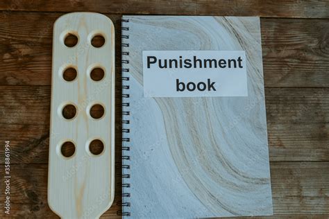 Fotografia Do Stock Punishment Book Wooden Paddle For Spanking On